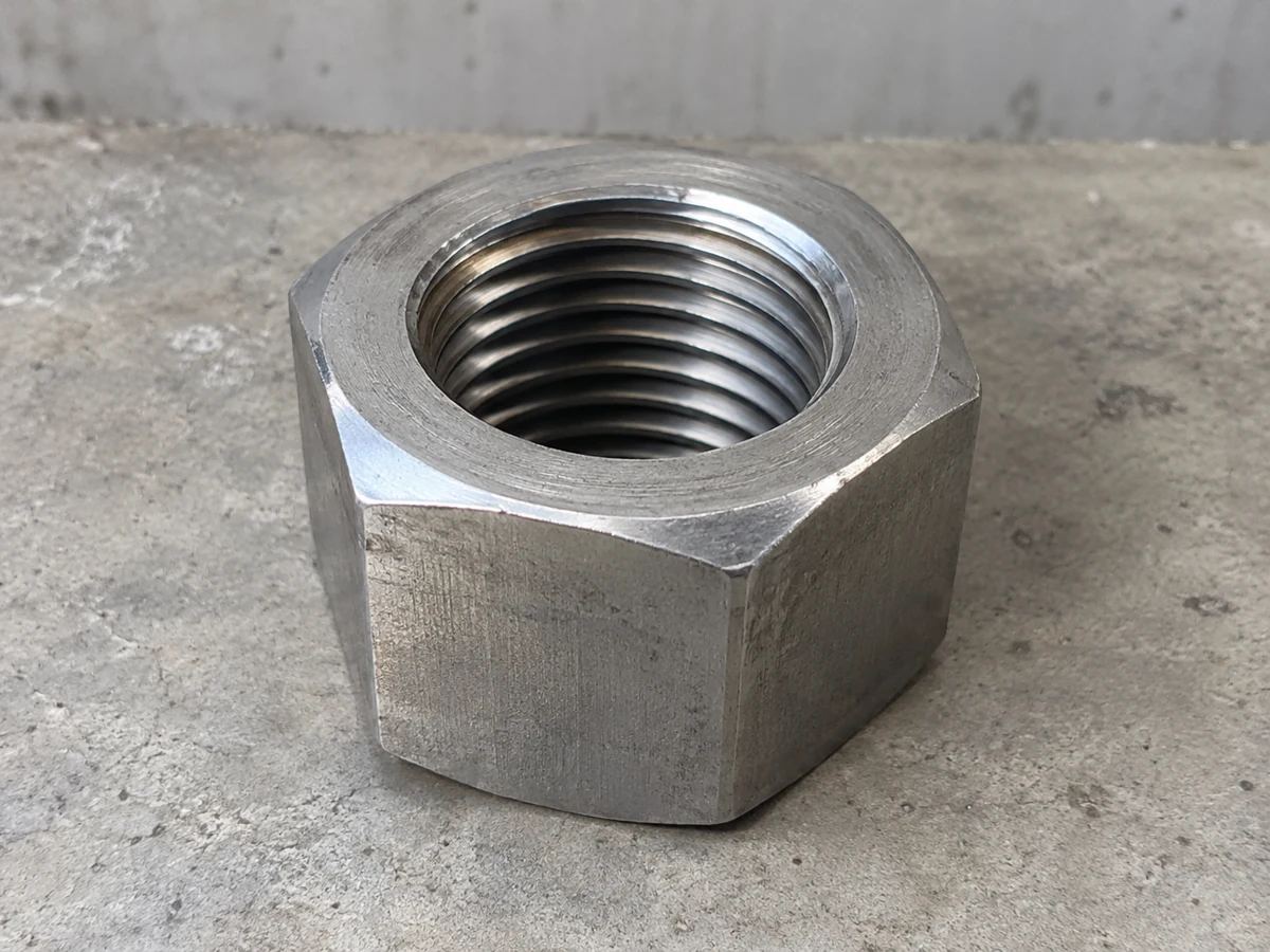 Blue-passivated steel hex nut — representative component illustration