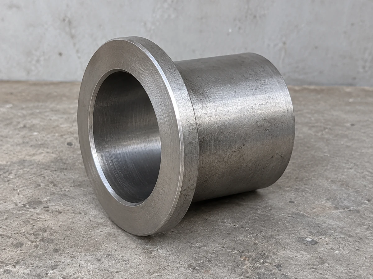 Zinc-nickel flanged steel bush — representative component illustration