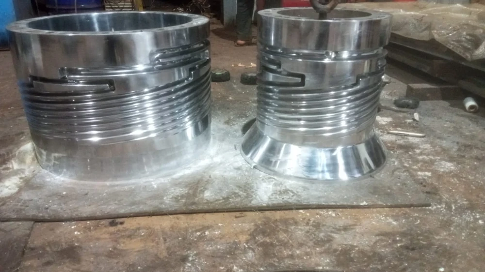Large grooved cylindrical components photographed in the DVS workshop